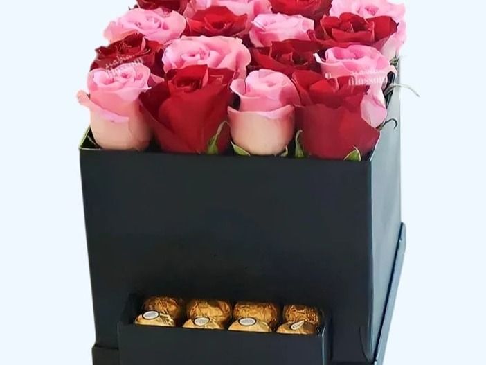 Red and pink roses with chocolate
